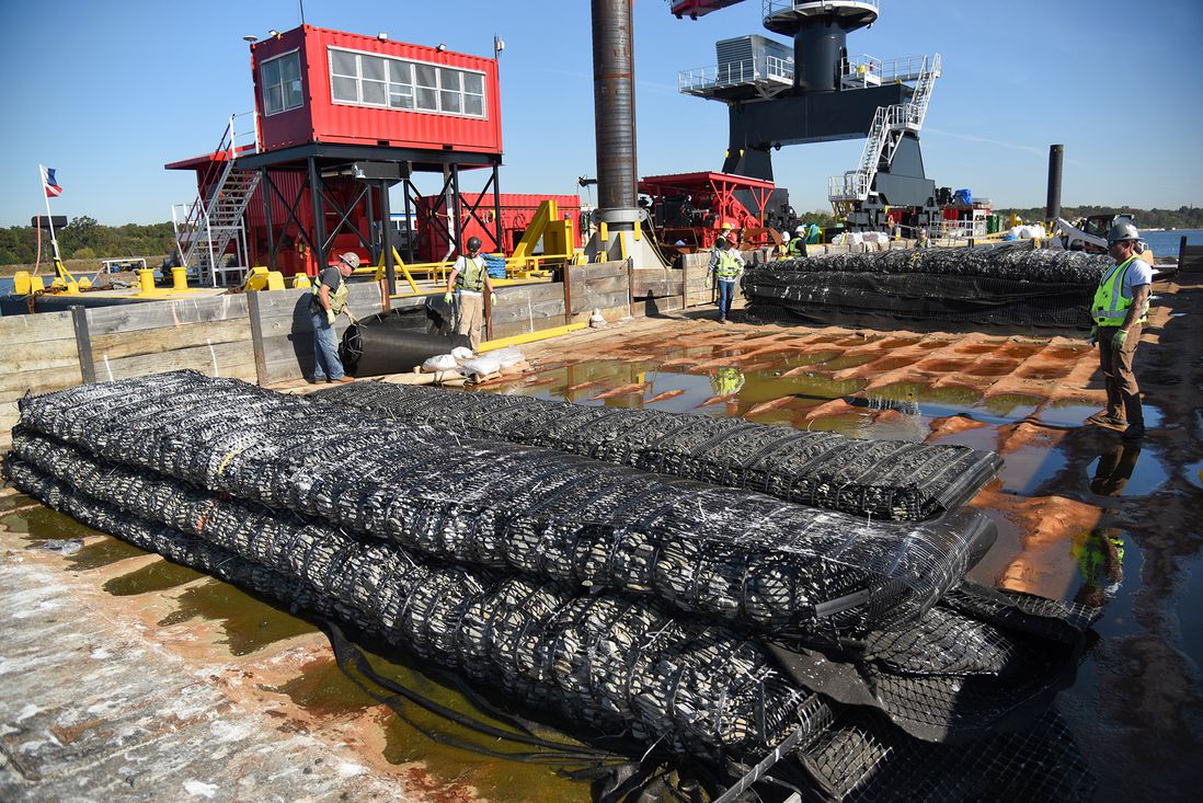 A smaller barge holds the stone filled marine mattresses, which are lowered one at a time to the bottom of Raritan Bay. Each mattress is 22 feet long, October 27th, 2021.